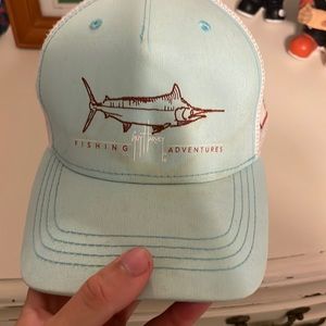 very worn guy harvey fishing hat